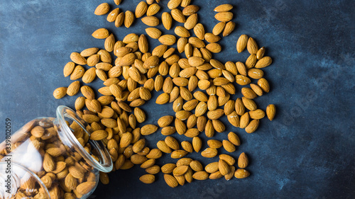 Almonds on a nice blue rustic background. Top view. Copy space. Healthy food concept 