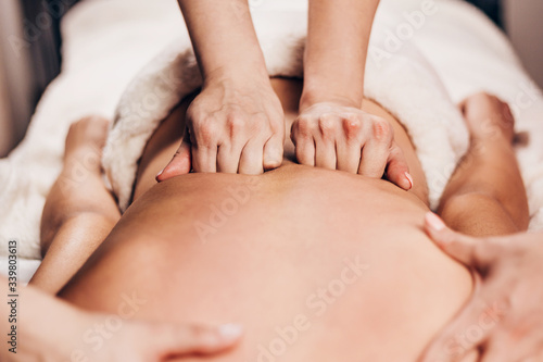 Double back massage in the salon - four-handed massage