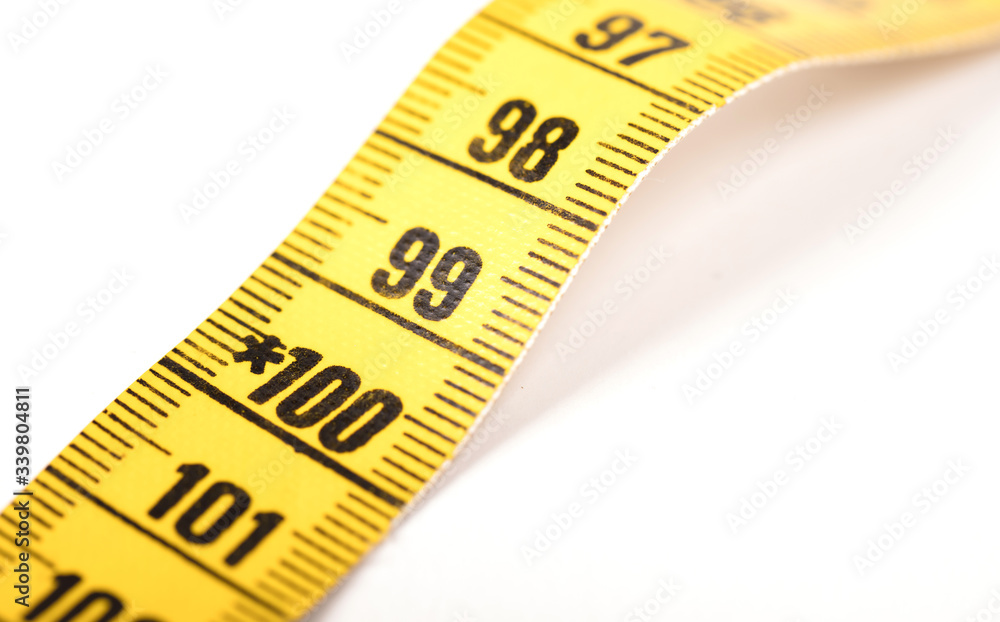 Close-up of a yellow measuring tape isolated on white - 100 Close-up of a yellow measuring tape isolated on white - 100