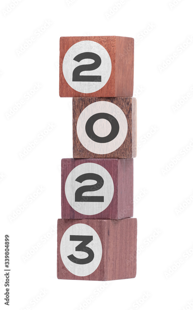 Four isolated hardwood toy blocks, saying 2023 Four isolated hardwood toy blocks, saying 2023