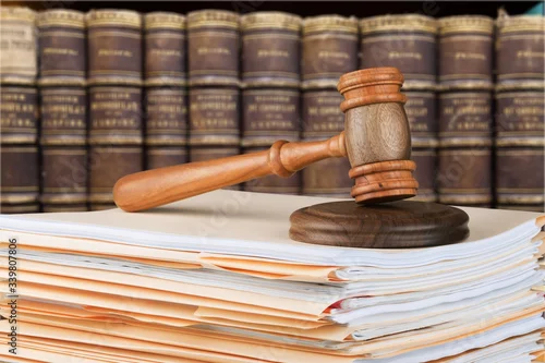 Obraz Judge wooden hammer and stack documents