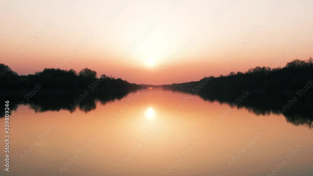 Sunset over the River Sava. Drone flying over beautiful nature at Golden Hour time. Spring areal view of River. Sunset over the River Sava. Drone flying over beautiful nature at Golden Hour time. Spring areal view of River.