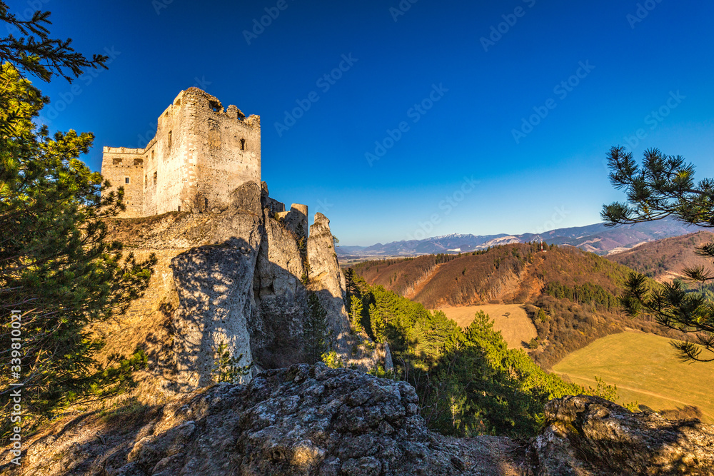 The medieval castle Lietava on a rocky reef with view of the surrounding landscape, nearby Zilina town, Slovakia, Europe.