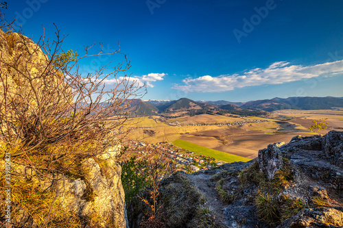 Spring landscape with valley and mountains in background. View from The Sunny Rocks in The Rajec Valley, Slovakia, Europe.