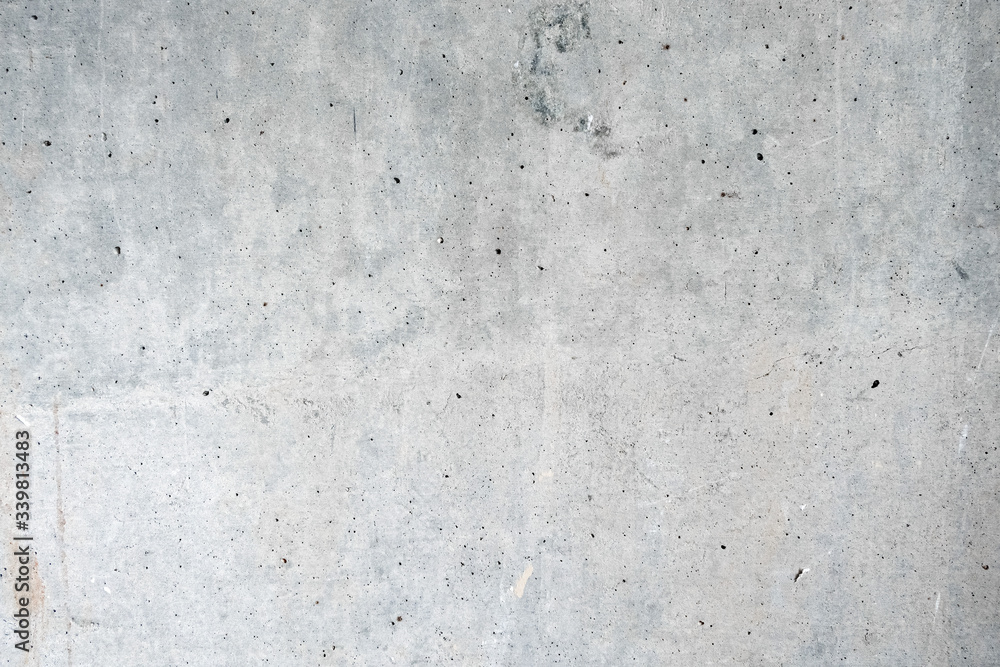 Gray concrete wall. The background of the old wall is light gray. Gray concrete wall. The background of the old wall is light gray.