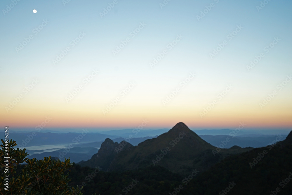 Sunrising view on top of the mountain peak Sunrising view on top of the mountain peak