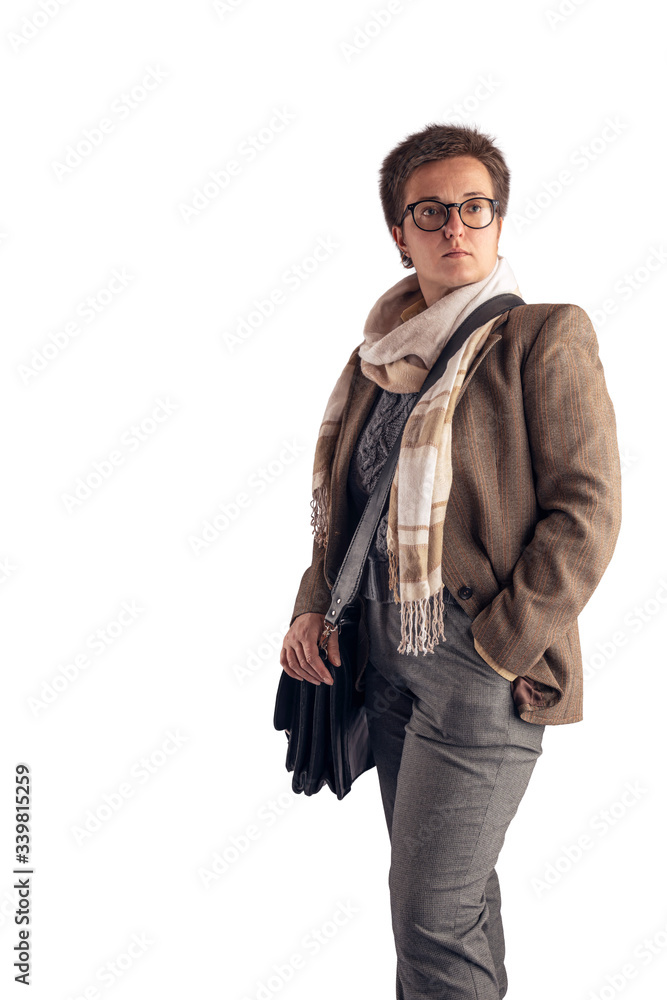 A woman with a short haircut, in a light jacket and with a light scarf around her neck, with a bag posing on a white background in the studio. Copy space. A woman with a short haircut, in a light jacket and with a light scarf around her neck, with a bag posing on a white background in the studio. Copy space.