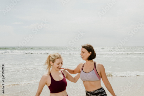 Active women stretching together