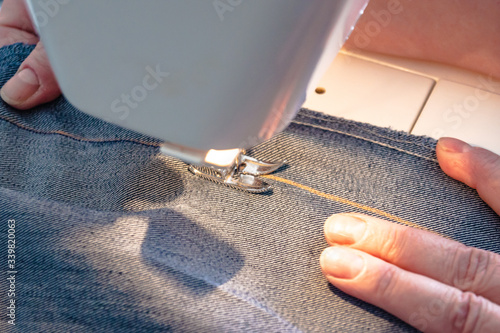 Process of sewing a stylish denim face mask, a hobby during COVID-19 pandemic.