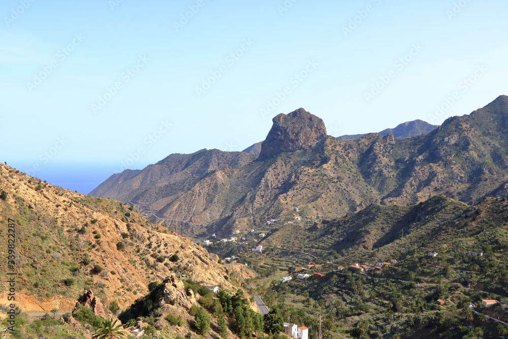 Fototapeta premium Colorful homes in Guaidil near Vallehermoso town and valley on the island of La Gomera, Canary Islands, Spain
