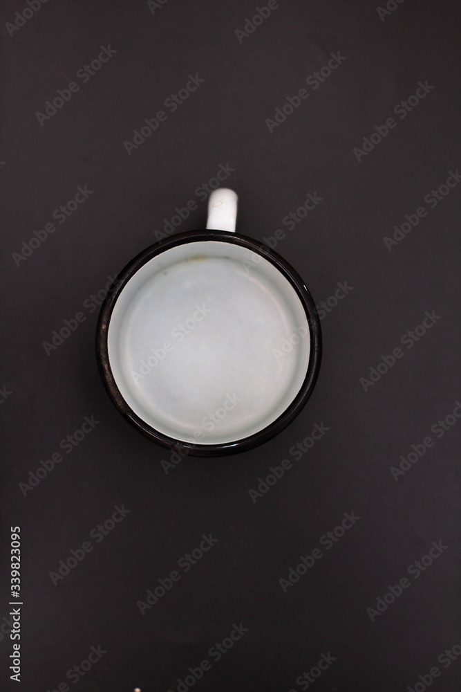Soviet iron water mug, black background Soviet iron water mug, black background