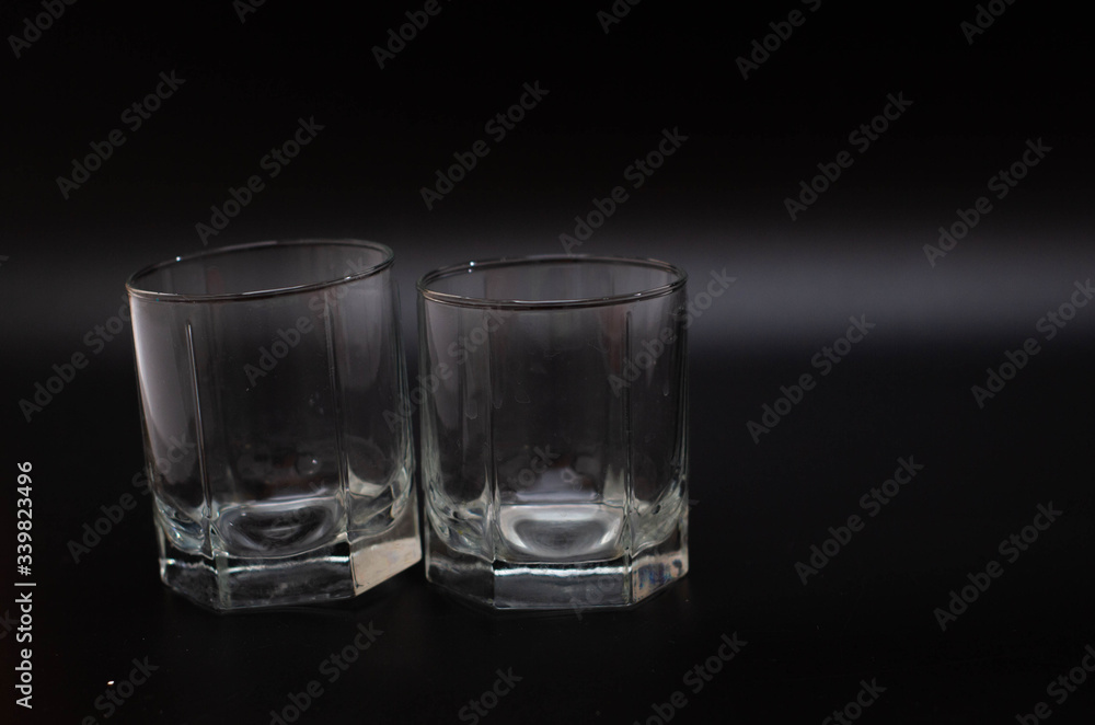 clear glasses for water on a black background clear glasses for water on a black background