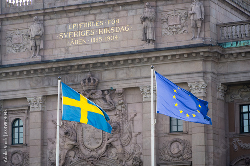 The Swedish flag and the flag of the European Union in front of the Swedish Parliament in Stockholm. 