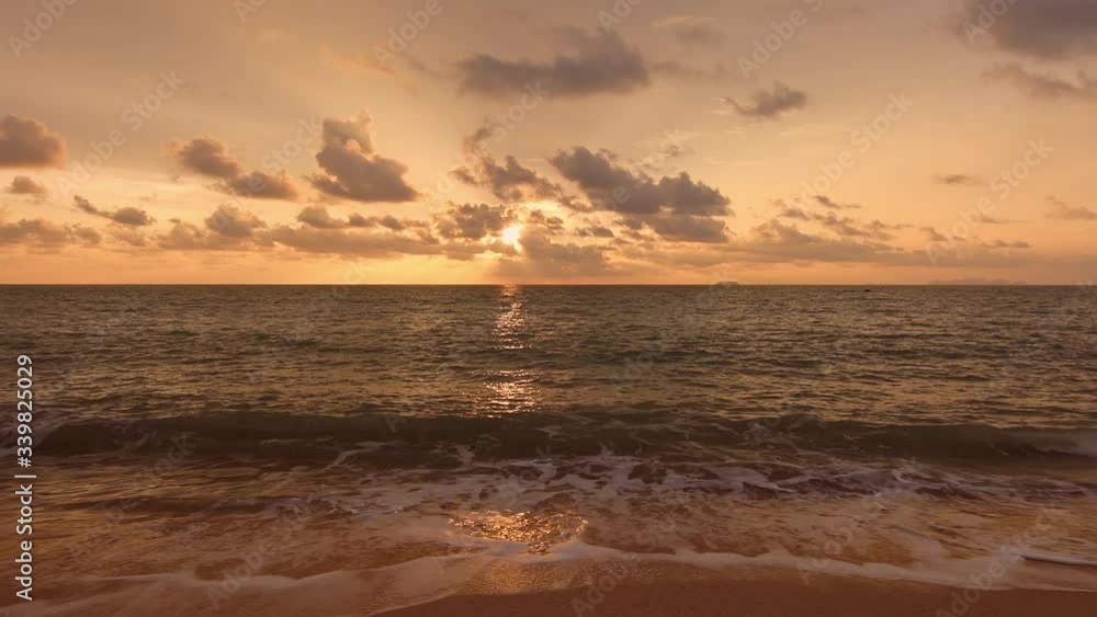 Beautiful sunset above sea at Koh Lanta beach, Thailand. Golden sunset above water, vibrant and soft colors. Dynamic sky with magic clouds. Concept of romantic moment at vacation. Beautiful sunset above sea at Koh Lanta beach, Thailand. Golden sunset above water, vibrant and soft colors. Dynamic sky with magic clouds. Concept of romantic moment at vacation.