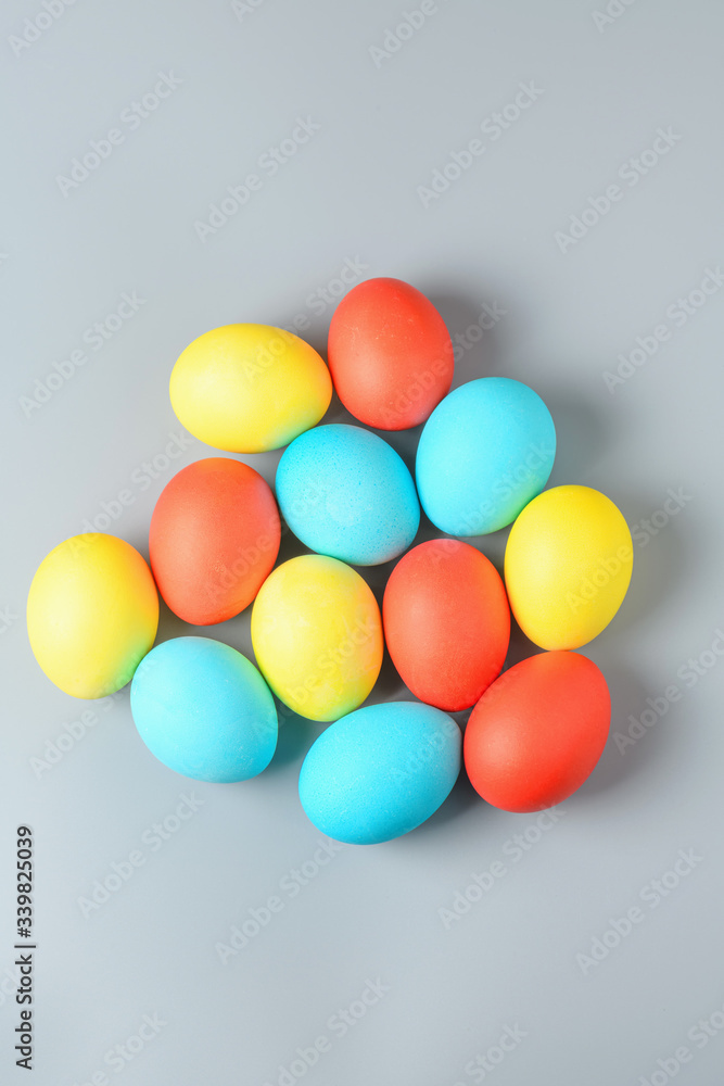 Colorful Easter eggs on a gray background. Easter eggs background. Easter eggs are a symbol and a mandatory attribute of the holiday. Colorful Easter eggs on a gray background. Easter eggs background. Easter eggs are a symbol and a mandatory attribute of the holiday.