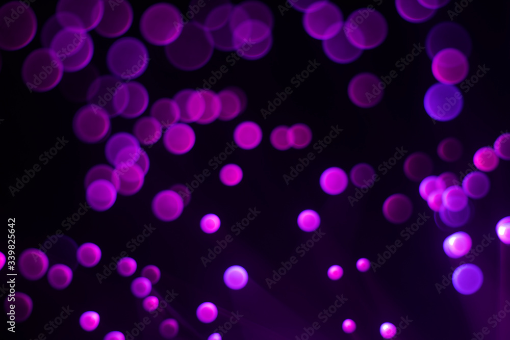 Glowing colored blurred dots. Colored fantasies. Bokeh.