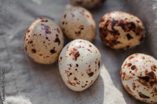 chocolate quail eggs on a cloth in a basket