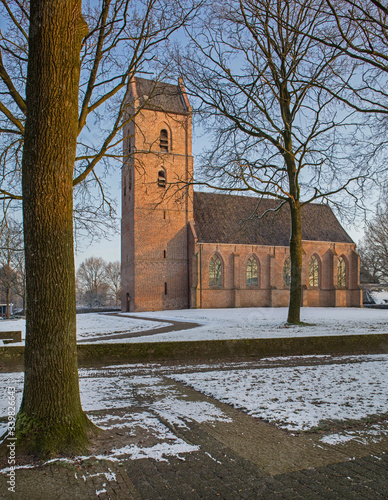 Winter. Snow. Church Vledder Drenthe Netherlands photo