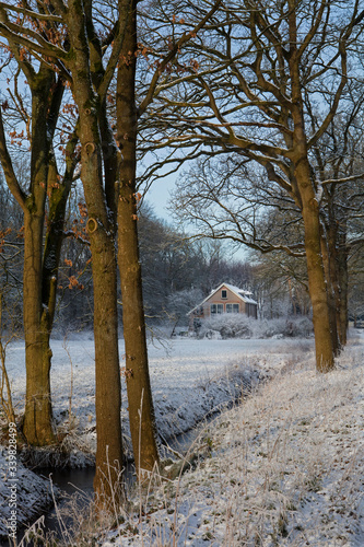 Fototapeta Naklejka Na Ścianę i Meble -  Historic schoolbuilding Boschoord winter Snow. Netherlands. Maatschappij van Weldadigheid 