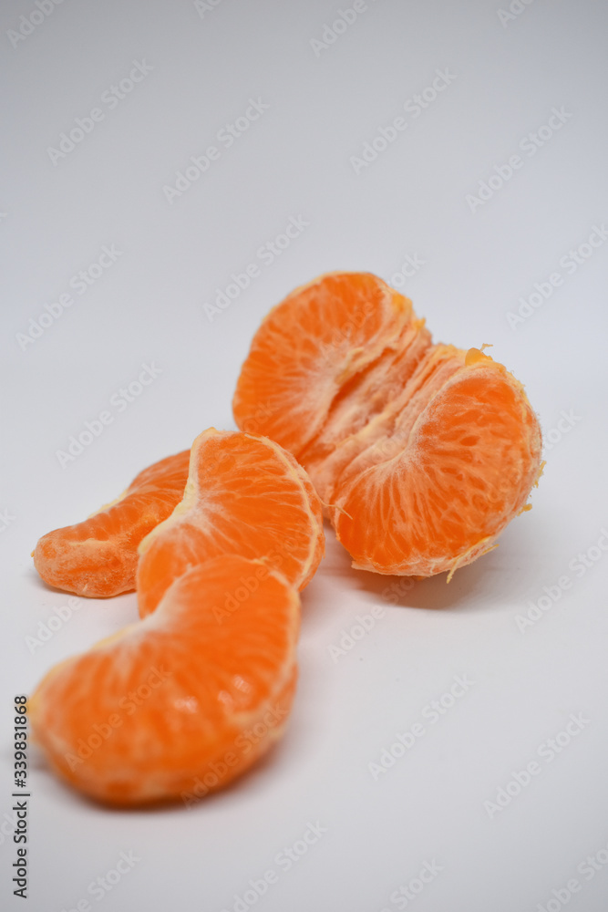 Peeled orange tangerine, white background, fruit, vitamin c Peeled orange tangerine, white background, fruit, vitamin c