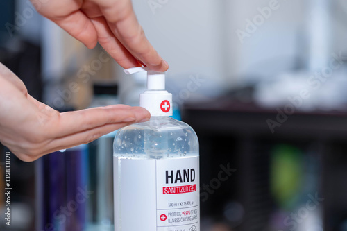 Fototapeta Naklejka Na Ścianę i Meble -  Close up hand sanitizer bottle gel to wash hands for killing germs virus and bacteria,hand sanitizer bottle gel to wash hands for virus COVID-19,hygiene prevention coronavirus concept.