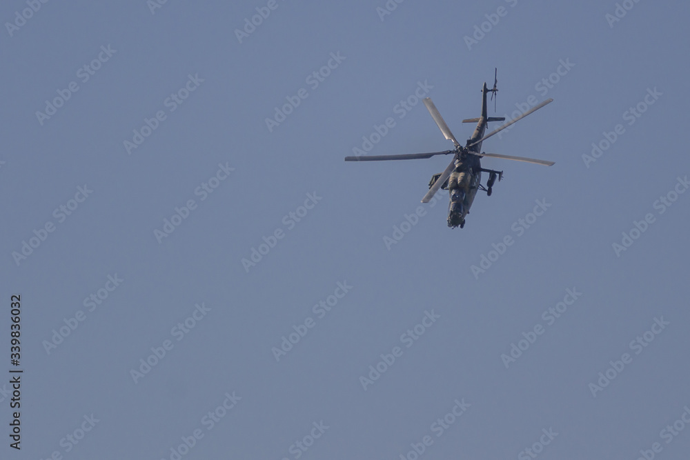 Fototapeta premium Aerobatics on a Mi-35 Hind helicopter