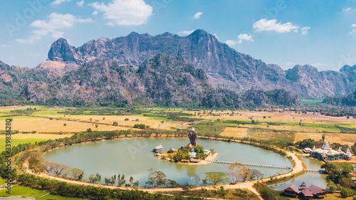 Kyaut Ka Lat Pagoda, beautiful lake pagoda with mount Zwegabin in the back. Hpa An, Myanmar.