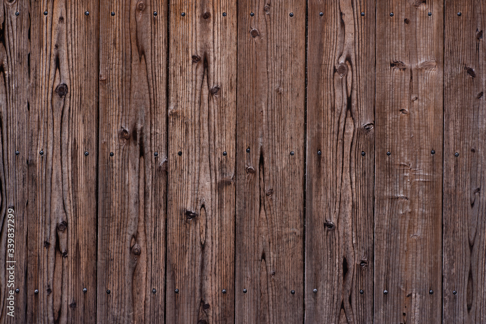 Fototapeta premium Dark wooden texture. Diagonal background brown wood planks.