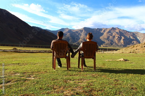 2 people enjoying a mountain view, Ladakh, Himalaya, India