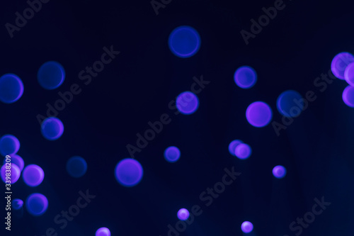 Glowing colored blurred dots. Colored fantasies. Bokeh.