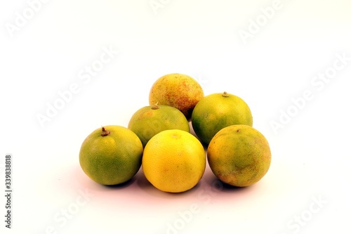 Green lemon fruit on white background