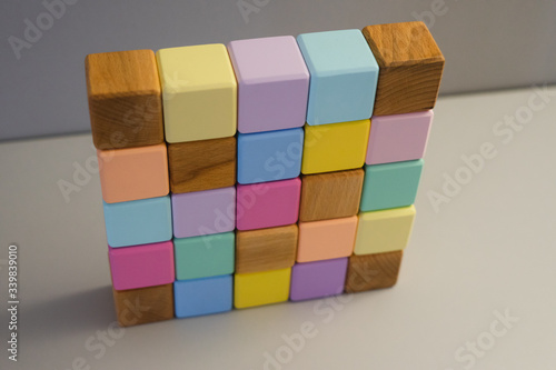 Colorful wooden cubes in a drawer. Eco-friendly materials.