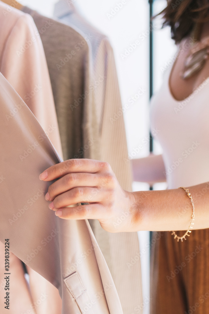 Fototapeta premium Woman selecting clothes