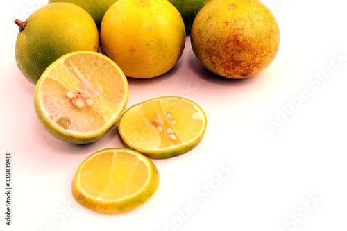 Green lemon fruit on white background