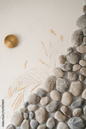 wall with stones and a Golden pattern in the form of spikelets