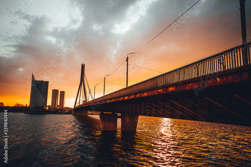 Vansu bridge in Riga cable-stayed bridge crosses the Daugava river in susnet time