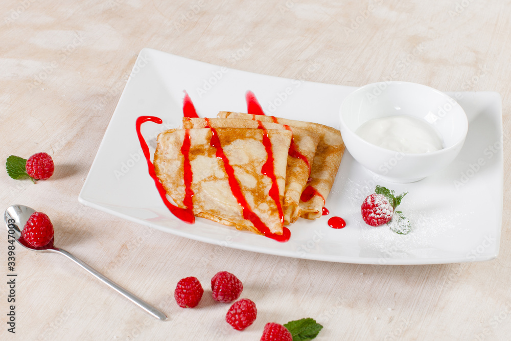 Pancakes with sour cream and jam