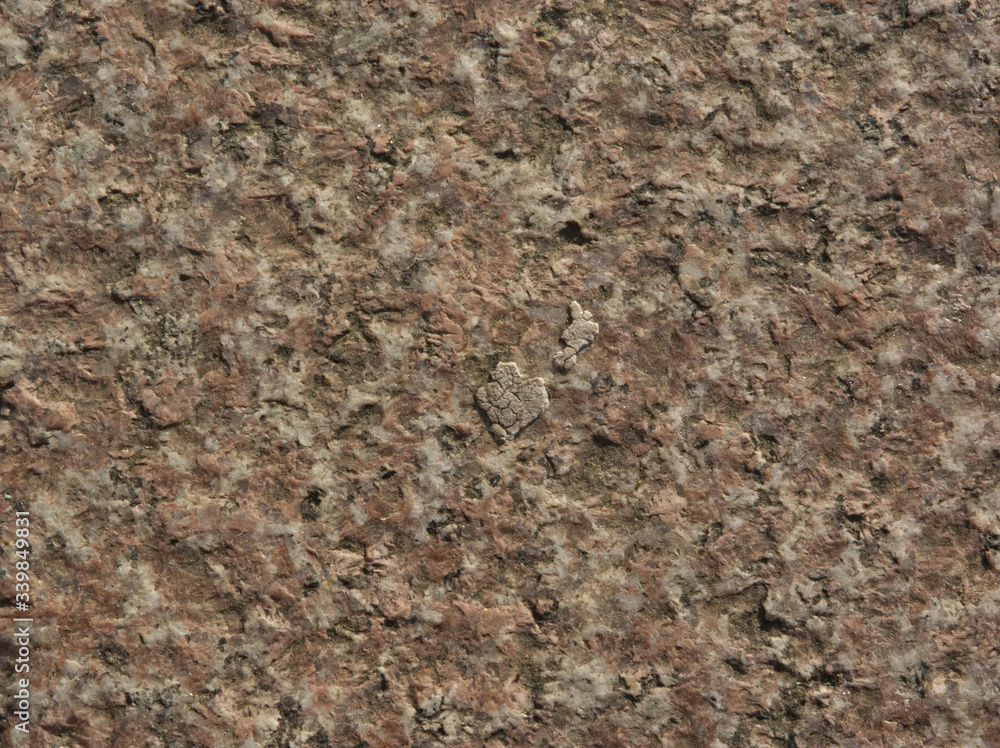 Red marble stone texture picture with reliefs at sunset Red marble stone texture picture with reliefs at sunset