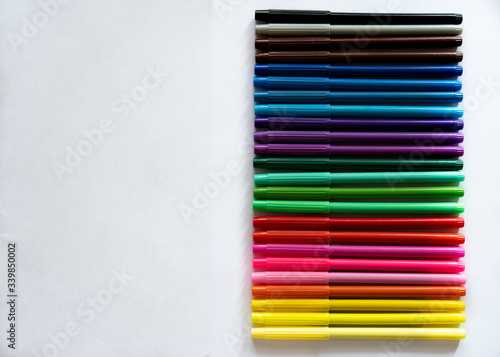  colored markers on a white background