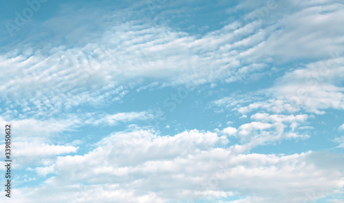 Clouds spread  patterns on bright blue sky background