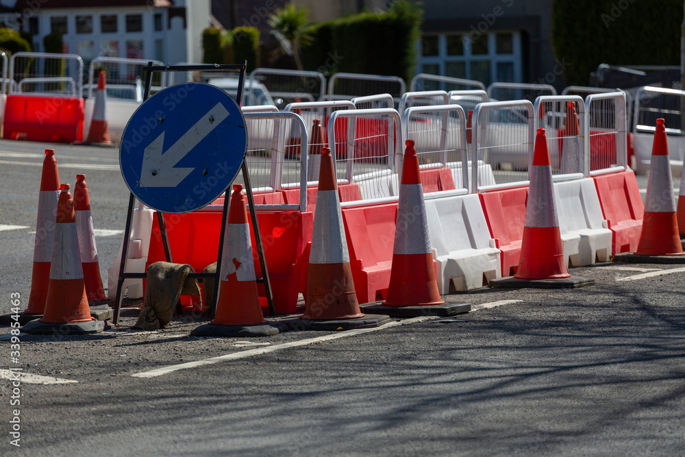 Safety cones and barriers placed to indicate access to road lanes for