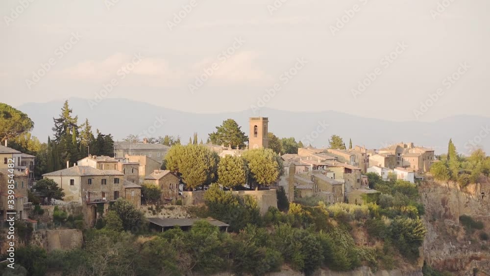 Italian Civita di Bagnoregio hilltop town, in Viterbo, Italy, on a sunny evening Italian Civita di Bagnoregio hilltop town, in Viterbo, Italy, on a sunny evening