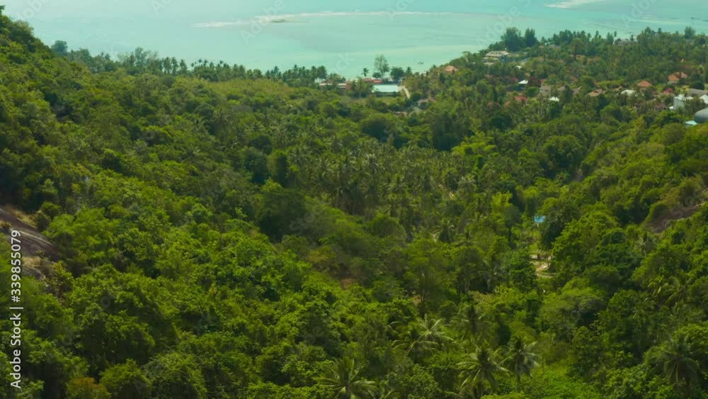 Video from a drone on samui island where you can see the beach road car people home rock mountain and palm trees with beautiful sea and ocean views in Siam Gulf of Thailand in excellent quality 4К Video from a drone on samui island where you can see the beach road car people home rock mountain and palm trees with beautiful sea and ocean views in Siam Gulf of Thailand in excellent quality 4К