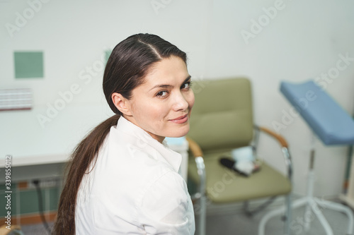 Attractive longhaired girl looking straight at camera