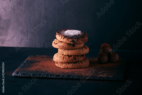 Chocolate cookies on wooden table. Chocolate chip cookies shot.. cookies look like very delicious with milk and chocolate balls (ID: 339855024)