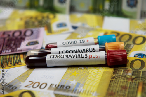 Euro banknote and positive test at coronavirus