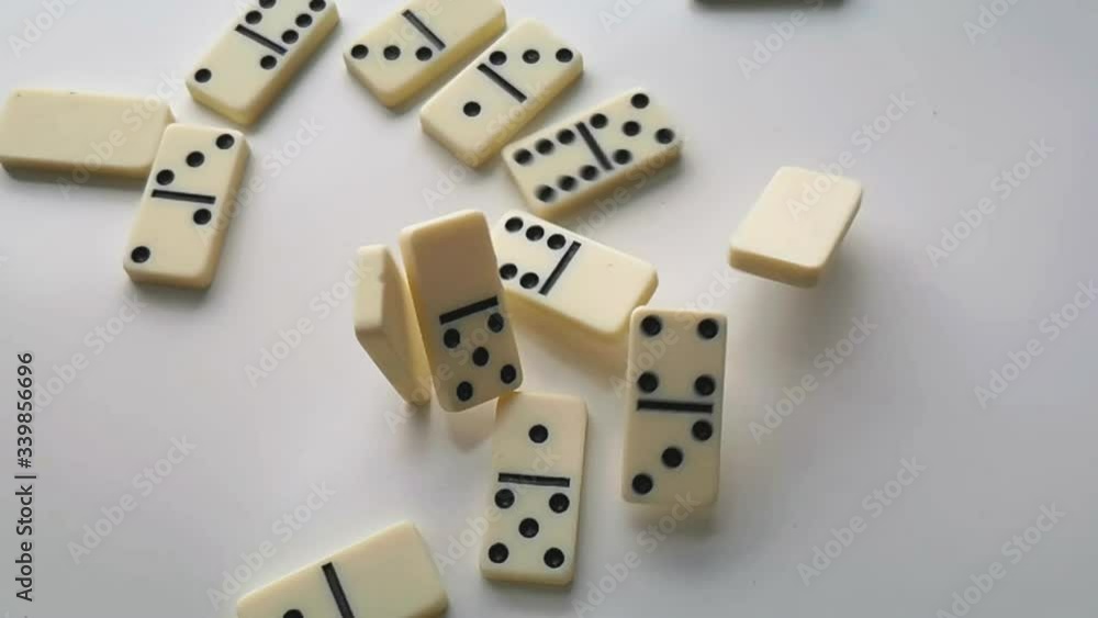 dominoes white with black dots fall and bounce dominoes white with black dots fall and bounce