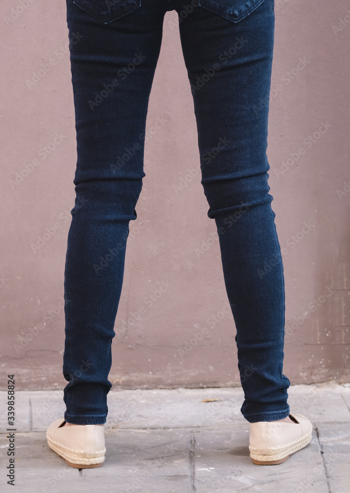 Happy Asia woman in denim skinny jeans, midnight blue jeans Happy Asia woman in denim skinny jeans, midnight blue jeans