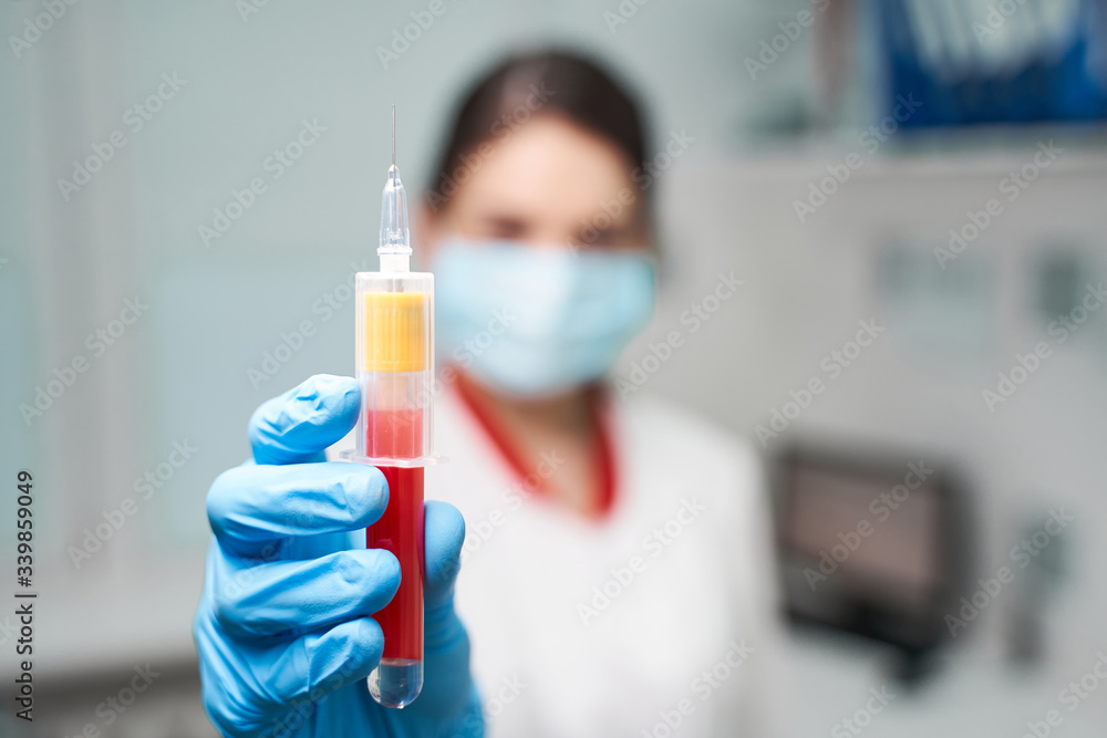 Close up of practitioner that demonstrating full test tube Close up of practitioner that demonstrating full test tube