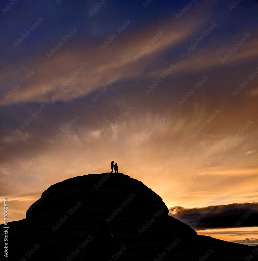 silhouette of man standing on top of a Tor on Dartmoor